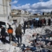 People search through the rubble of collapsed buildings where a newborn girl was found in the town of Jinderis, Aleppo province, Syria, Tuesday, Feb. 7, 2023. Residents in the northwest Syrian town discovered the crying infant, whose mother gave birth to her while buried underneath the rubble of a five-story apartment building leveled by this week's devastating earthquake, relatives and a doctor say. (AP Photo/Ghaith Alsayed)