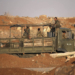 Syrian government soldiers ride in an army truck near the Nassib border crossing with Jordan in the southern province of Daraa on July 6, 2018, after they regained control over it from rebel forces. - The Nassib crossing was overrun by rebels in April 2015, sealing off the regime's crucial trade route with neighbouring Jordan, which calls it Jaber. With the crossing's recapture two weeks into a Russian-backed offensive, the government hopes it can reopen the vital trade lifeline. (Photo by Mohamad ABAZEED / AFP)