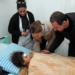 A handout picture released by the official Syrian Arab News Agency (SANA)on February 11, 2023, shows Syria's President Bashar al-Assad (R) and first lady Asma al-Assad (C) visiting a wounded survivor of the earthquake, that hit Turkey and Syria, at Tishreen University Hospital in Latakia. - The 7.8-magnitude quake struck early on January 6 as people slept, in a region where many had already suffered loss and displacement due to Syria's civil war. (Photo by SANA / AFP) / == RESTRICTED TO EDITORIAL USE - MANDATORY CREDIT "AFP PHOTO / HO /SYRIAN ARAB NEWS AGENCY SANA" - NO MARKETING NO ADVERTISING CAMPAIGNS - DISTRIBUTED AS A SERVICE TO CLIENTS ==
