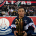 Paris Saint-Germain's French forward Kylian Mbappe poses with a trophy in front of supporters at the end of a ceremony after he became Paris Saint-Germain's all-time top scorer with his 201st goal for the club in their 4-2 win in the French L1 football match against FC Nantes at The Parc des Princes Stadium in Paris on March 4, 2023. (Photo by FRANCK FIFE / POOL / AFP)