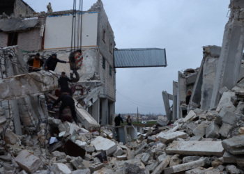 Rescuers search for survivors under the rubble, following an earthquake, in Al Atarib, Syria February 6, 2023 in this picture obtained from social media. White Helmets/via REUTERS  THIS IMAGE HAS BEEN SUPPLIED BY A THIRD PARTY. MANDATORY CREDIT. NO RESALES. NO ARCHIVES.