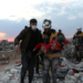 A member of a rescue team carries the body of a child in the aftermath of a deadly earthquake in Jandaris, Syria February 10, 2023 in this picture obtained from social media. White Helmets/via REUTERS  THIS IMAGE HAS BEEN SUPPLIED BY A THIRD PARTY. MANDATORY CREDIT. NO RESALES. NO ARCHIVES.  REFILE - CORRECTING INFORMATION