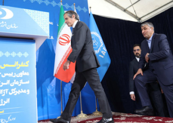 Head of Iran's Atomic Energy Organization Mohammad Eslami and International Atomic Energy Agency (IAEA) Director General Rafael Grossi arrive at a news conference, in Tehran, Iran, March 4, 2023. Majid Asgaripour/WANA (West Asia News Agency) via REUTERS ATTENTION EDITORS - THIS IMAGE HAS BEEN SUPPLIED BY A THIRD PARTY.