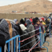 Syrian refugees wait to register upon their arrival in the strategic Lebanese border district town of Arsal on Nov. 18, 2013, after fleeing the fighting in the neighboring Syria. Thousands of Syrian refugees have poured into Lebanon over the past week as fighting between government forces and rebels has flared near the border. AFP PHOTO / STR (Photo credit should read -/AFP/Getty Images)