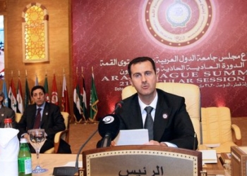 Syrian President Bashar al-Assad addresses the opening session of the Arab League summit meeting in Doha, Qatar on March 30, 2009. Arab leaders opened their annual summit in the presence of the Sudanese leader, who is wanted by the International Criminal Court, but without Egyptian President Hosni Mubarak, who is snubbing the meeting. Assad said Arab countries which launched a Middle East peace initiative in 2002 do not have a real partner in Israel.  AFP PHOTO/MAHMUD TURKIA (Photo by MAHMUD TURKIA / AFP)