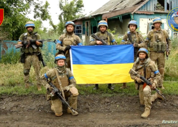 Ukrainian servicemen of the 35th Separate Brigade of Marines pose for a photograph with the Ukrainian flag in the liberated village of Storozheve, in Dontesk region, Ukraine, in the still image taken from a social media video released on June 12, 2023.   35th Separate Brigade of Marines via Facebook/via REUTERS    THIS IMAGE HAS BEEN SUPPLIED BY A THIRD PARTY