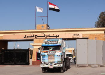 A truck crosses from Gaza to Egypt, at the Rafah border crossing between Egypt and the Gaza Strip, amid the ongoing conflict between Israel and Palestinian Islamist group Hamas, in Rafah, Egypt, February 1, 2024. REUTERS/Mohamed Abd El Ghany