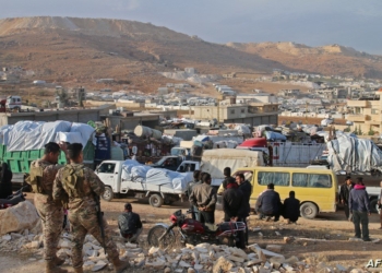 Syrians refugees prepare to leave Lebanon towards Syrian territory through the Wadi Hamid crossing in Arsal on October 26, 2022. A first batch of Syrian refugees left Lebanon today for their home country, an AFP photographer said, the first step in a new repatriation plan slammed by rights groups. (Photo by AFP)