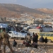 Syrians refugees prepare to leave Lebanon towards Syrian territory through the Wadi Hamid crossing in Arsal on October 26, 2022. A first batch of Syrian refugees left Lebanon today for their home country, an AFP photographer said, the first step in a new repatriation plan slammed by rights groups. (Photo by AFP)