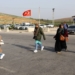 epa10500824 Syrians who were living in Hatay city, try to cross the Turkish-Syrian border at Cilvegozu border gate,Turkey, 03 March 2023. Tens of thousands of Syrians are returning to their country following the powerful earthquakes which struck the region on 06 February and again on 20 February resulting in more than 50,000 fatalities.  EPA/SEDAT SUNA