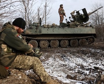 Ukrainian anti-aircraft gunners of the 93rd Separate Mechanized Brigade Kholodny Yar monitor the sky from their positions in the direction of Bakhmut in the Donetsk region, amid the Russian invasion of Ukraine, on February 20, 2024. (Photo by Anatolii STEPANOV / AFP)