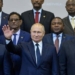 Russian President Vladimir Putin (C) gestures as Egypt's President Abdel Fattah al-Sisi (L) and South African President Cyril Ramaphosa (R) pose for a family photo with African countries leaders attending 2019 Russia-Africa Summit and Economic Forum in Sochi on October 24, 2019. (Photo by Alexei Druzhinin / SPUTNIK / AFP)